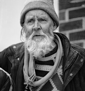 A street portrait of a man in Chicago that use to be a famous painter.
